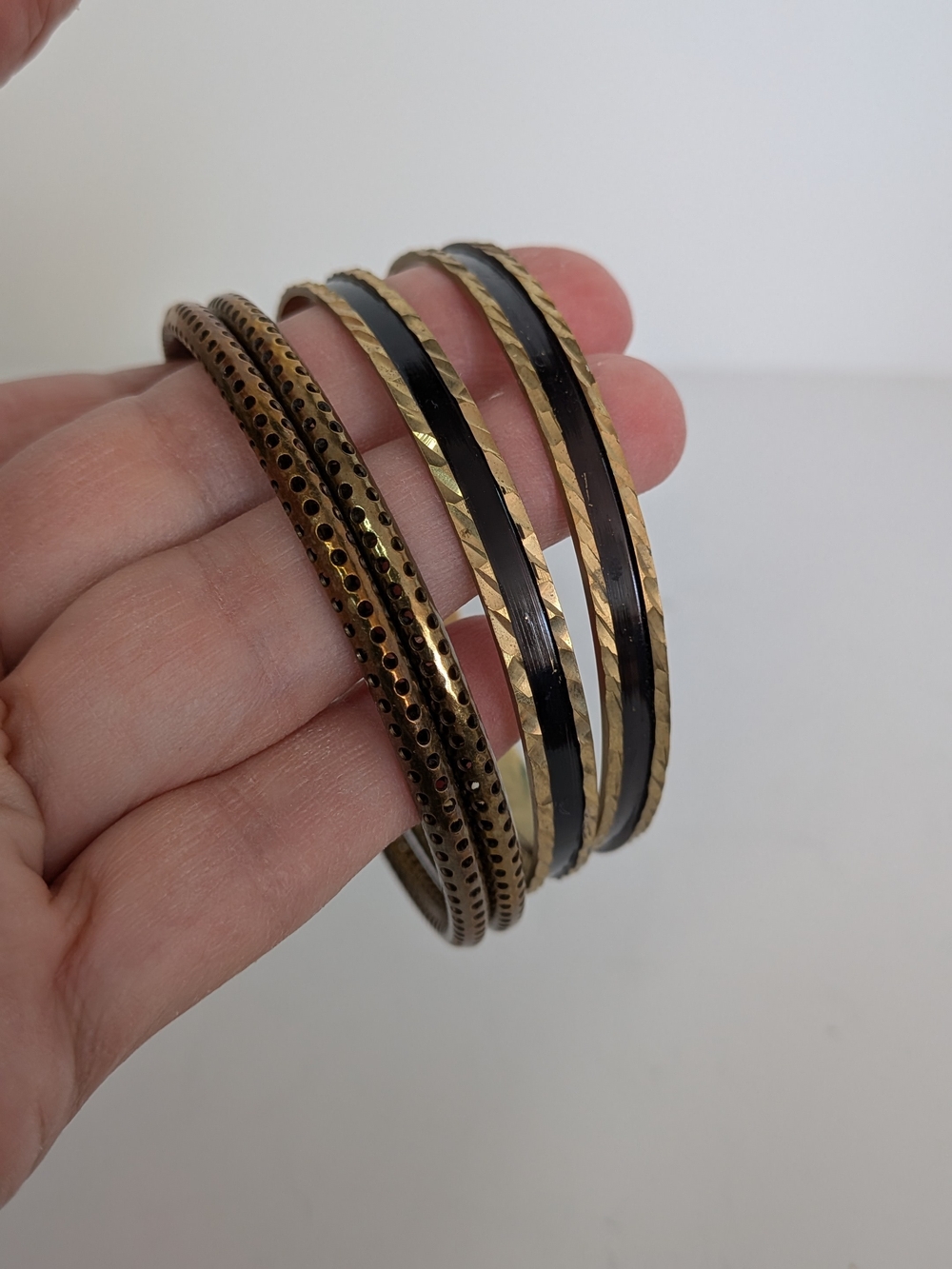 4 Gold and black Bangles bracelets (2) perforated Holed (2) brass